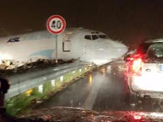 Cargo plane crashes into oncoming road traffic after overshooting runway at Italian airport
