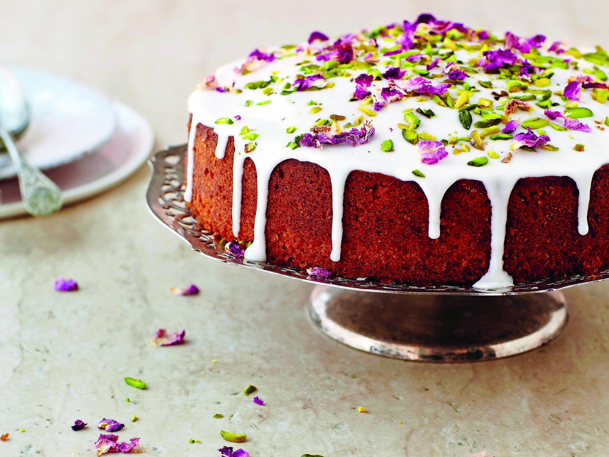 With scents from a Persian floral garden in spring, the cake is decorated in pistachios and rose petals (recipe below)