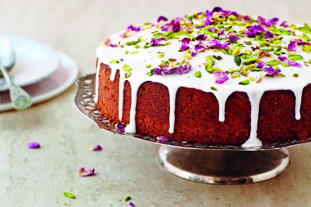 With scents from a Persian floral garden in spring, the cake is decorated in pistachios and rose petals (recipe below)
