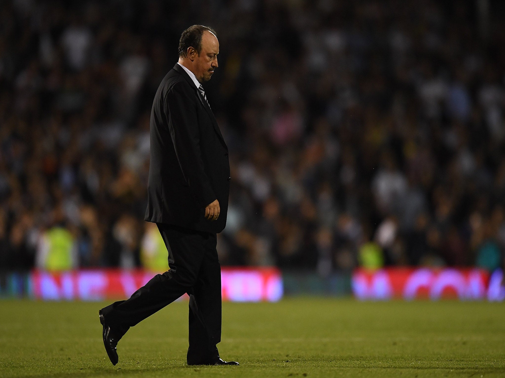 Rafael Benitez walks off dejected after a first defeat of the season