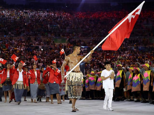 Pita Nikolas Aufatofua of Tonga carries the flag during the opening ceremony of the Rio 2016 Olympic Games