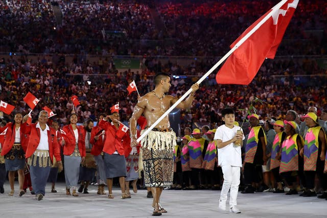 Pita Nikolas Aufatofua of Tonga carries the flag during the opening ceremony of the Rio 2016 Olympic Games