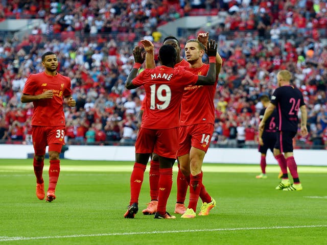 Sadio Mane is congratulated after scoring Liverpool's opener at Wembley