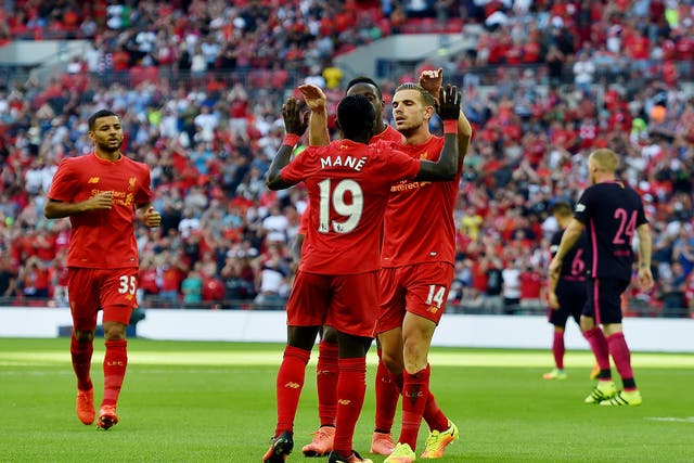 Sadio Mane is congratulated after scoring Liverpool's opener at Wembley