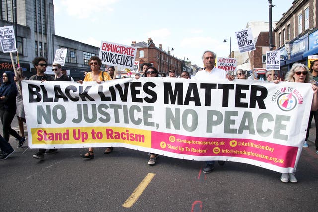 Black Lives Matter protesters walk through the streets 