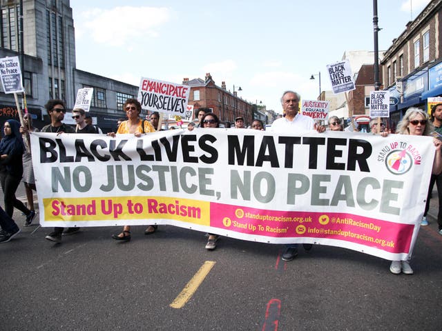 Black Lives Matter protesters walk through the streets 