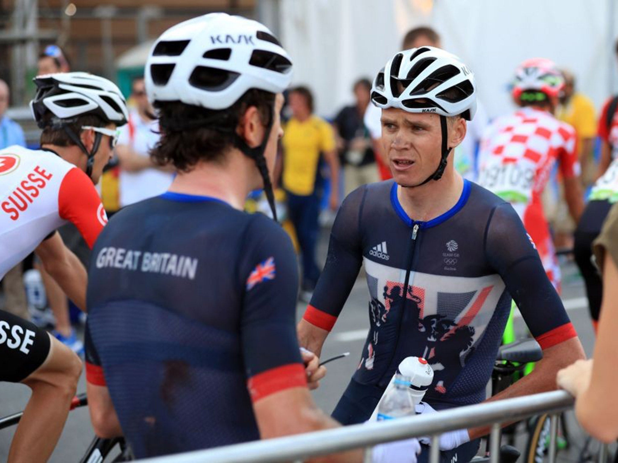 Chris Froome speaks with a bruised Geraint Thomas after the men's road race