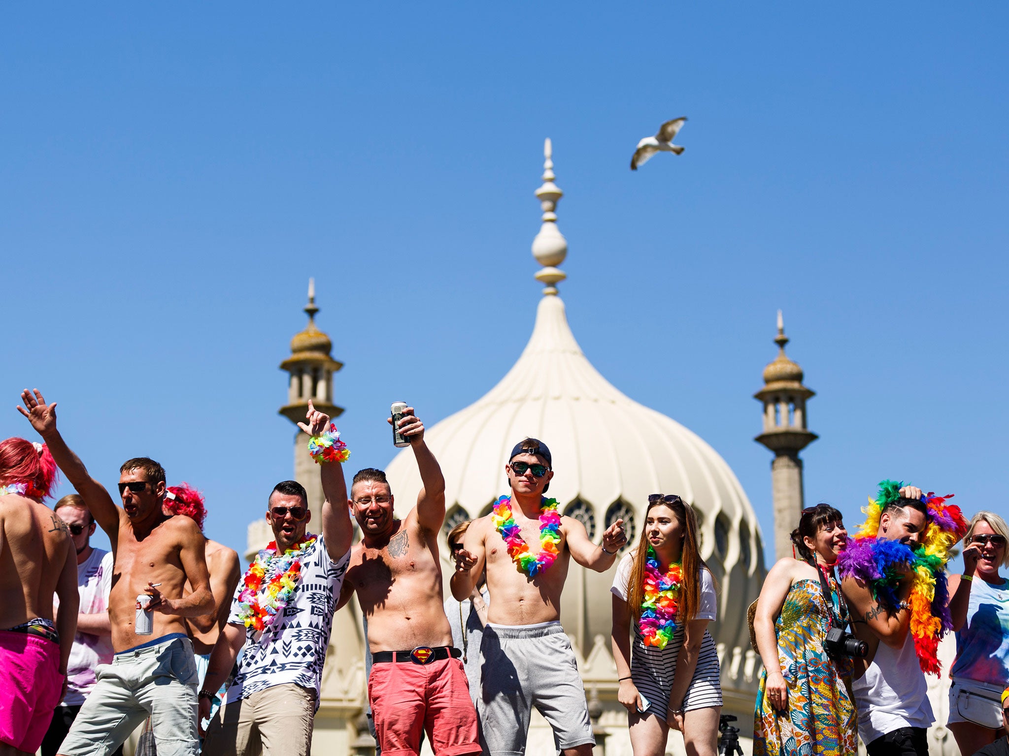Revellers enjoy the sun in Brighton during the recent Pride parade