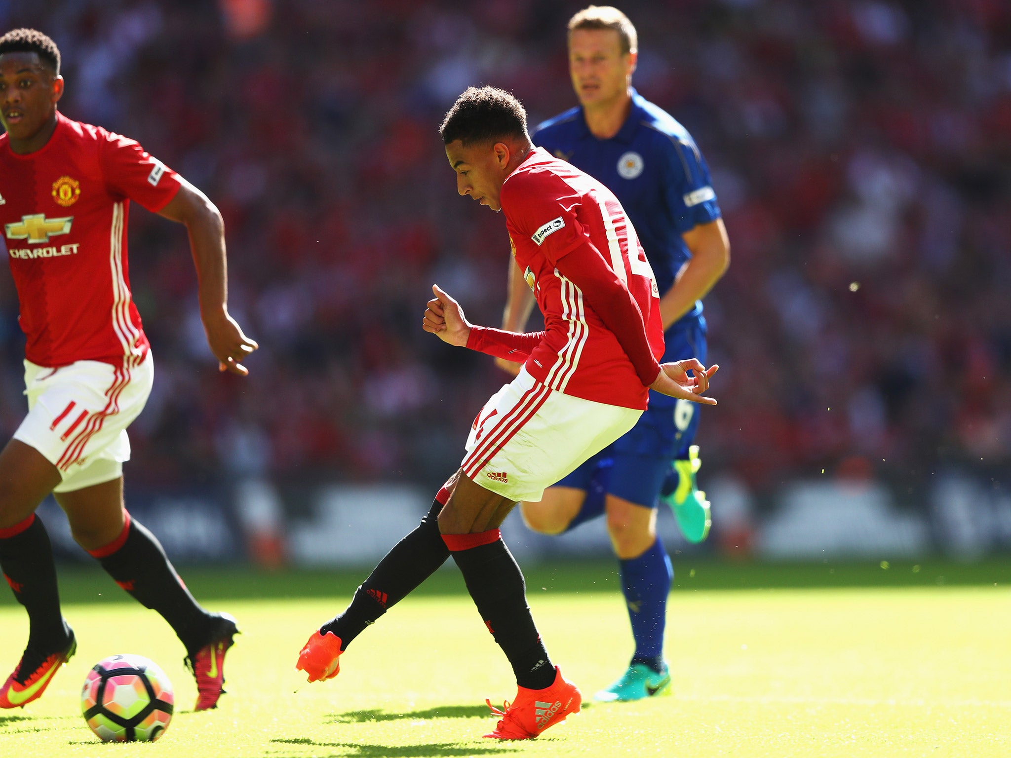 Jesse Lingard strokes the ball home to open the scoring for United