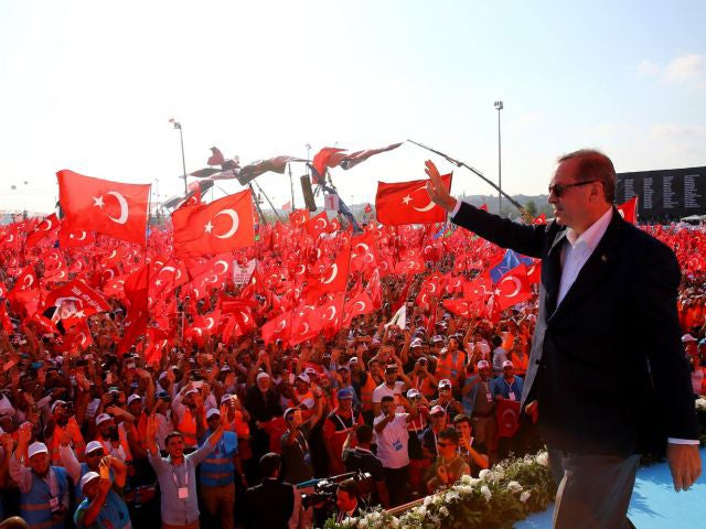Turkish President Recep Tayyip Erdogan greeting people as they gather at Yenikapi in Istanbul during a rally against failed military coup