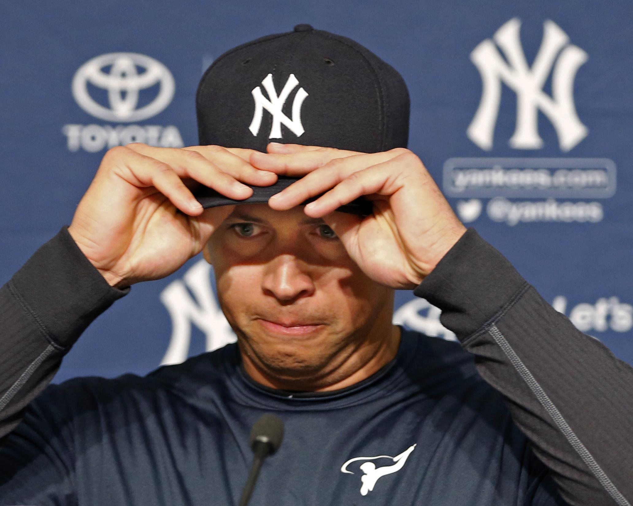 Rodriguez struggled to put his Yankees cap on at a press conference to announce his final game