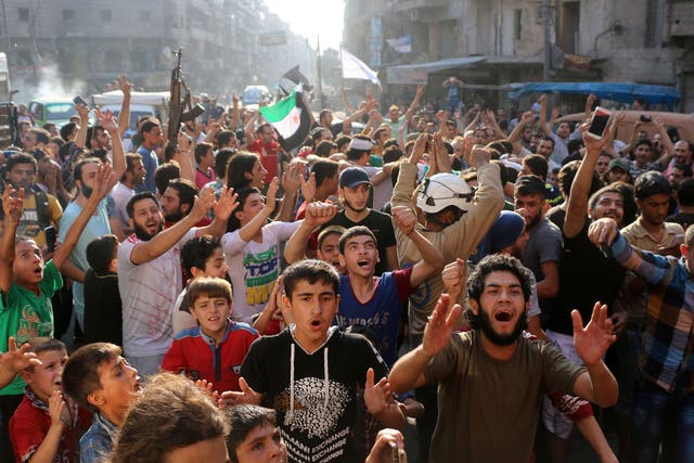 Syrian gather in Aleppo in celebrations after rebels said they have broken a three-week government siege 
