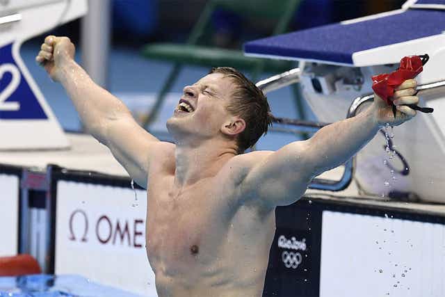 <p>Adam Peaty celebrates another gold medal in the pool</p>