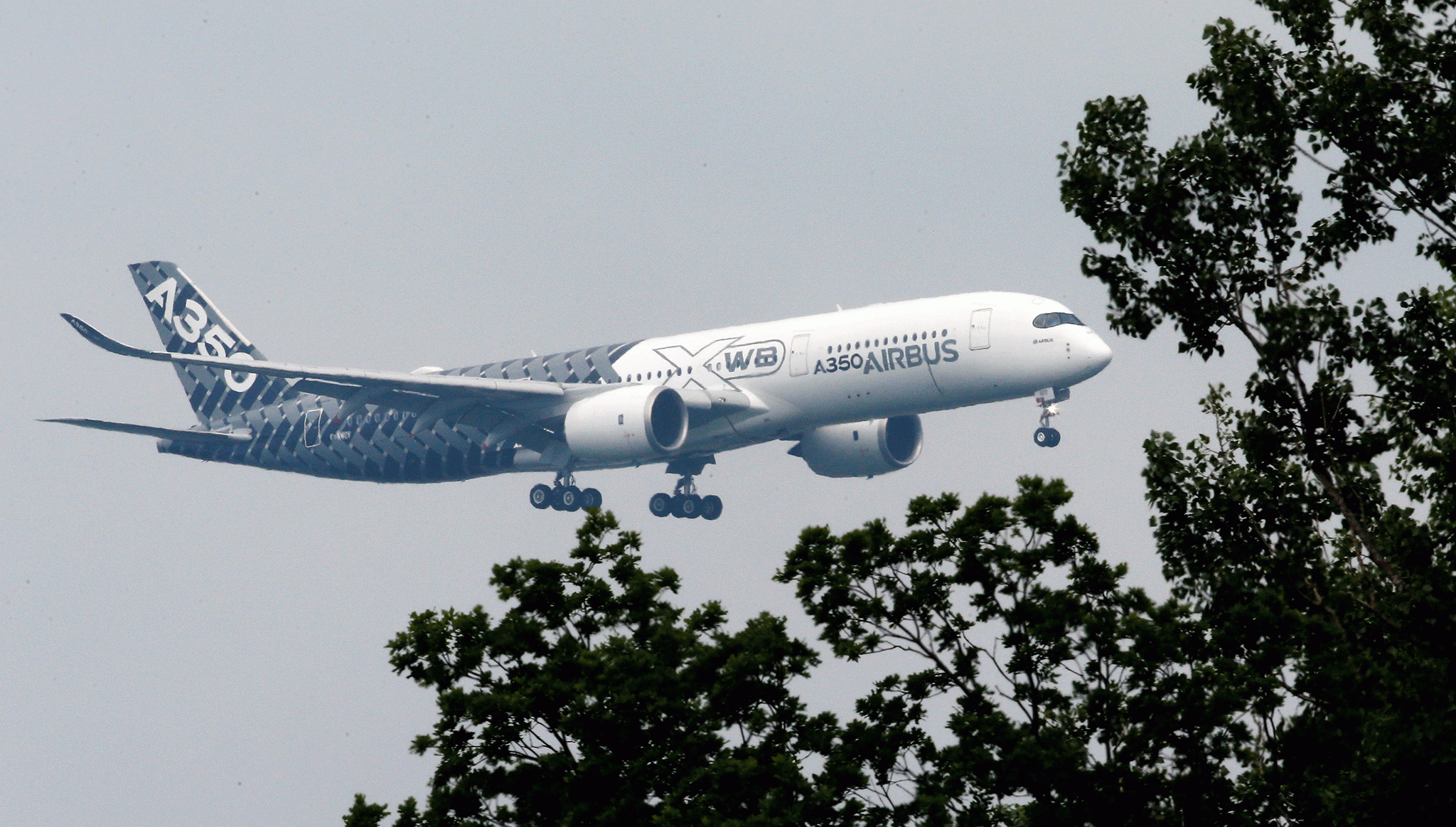 Airbus A350 plane pictured at the Berlin Airshow in June - the company is accused of hiring third party consultants who bribed officials