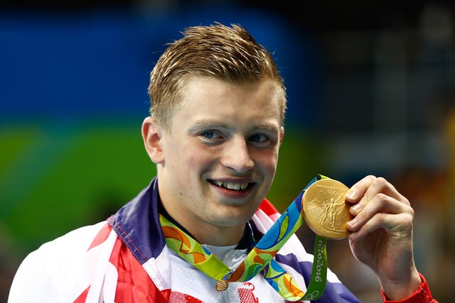 Peaty shows off his gold medal with pride