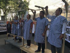 Iranian opposition activists stage mock execution outside Downing Street to mark anniversary of 1988 massacre
