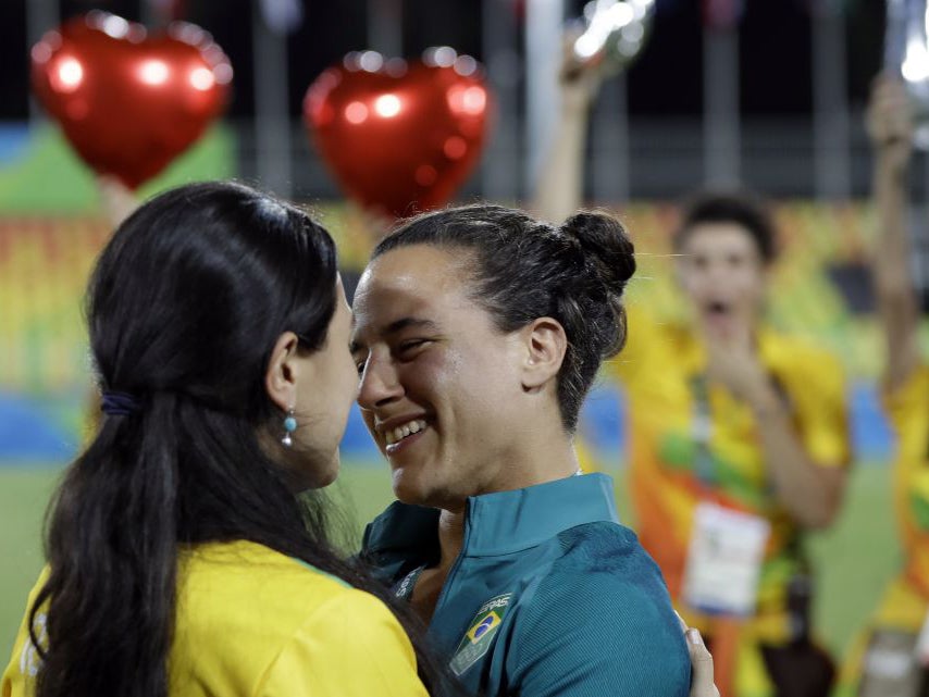 Brazil's Isadora Cerullo, right, shares a moment with her partner Marjorie Enya