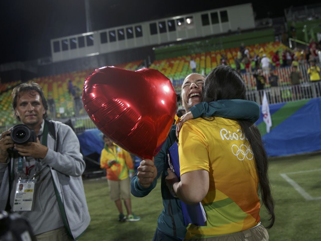 Isadora Cerullo hugs Marjorie, a volunteer, after receiving her wedding proposal (Reuters )