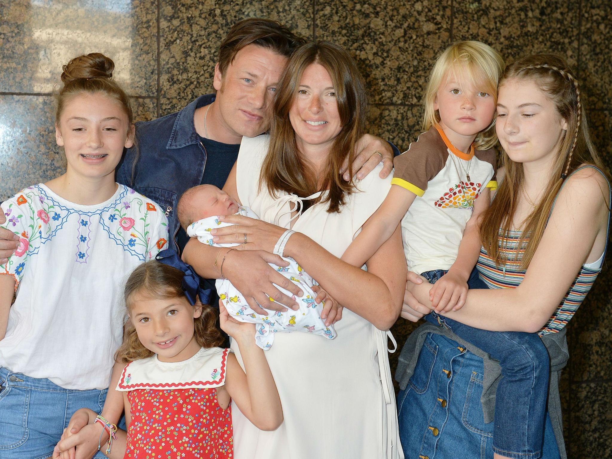 The Oliver family leave London's Portland hospital with their new addition
