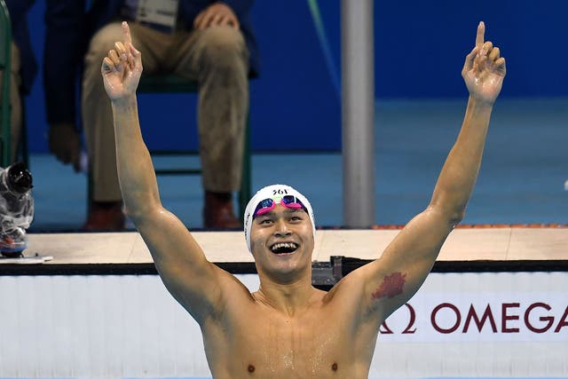 Sun Yang celebrates winning 200m freestyle gold