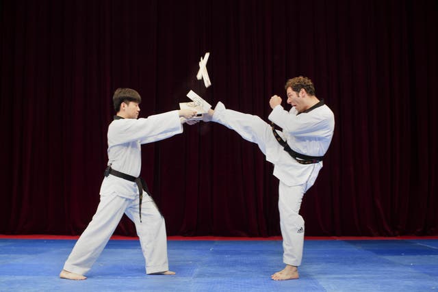 Journalist Jonathan Thompson learning the power of taekwondo