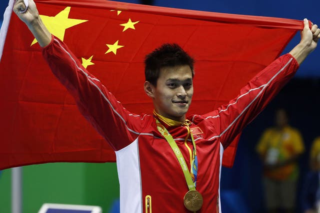 Sun Yang celebrates winning gold in the men's 200m freestyle final