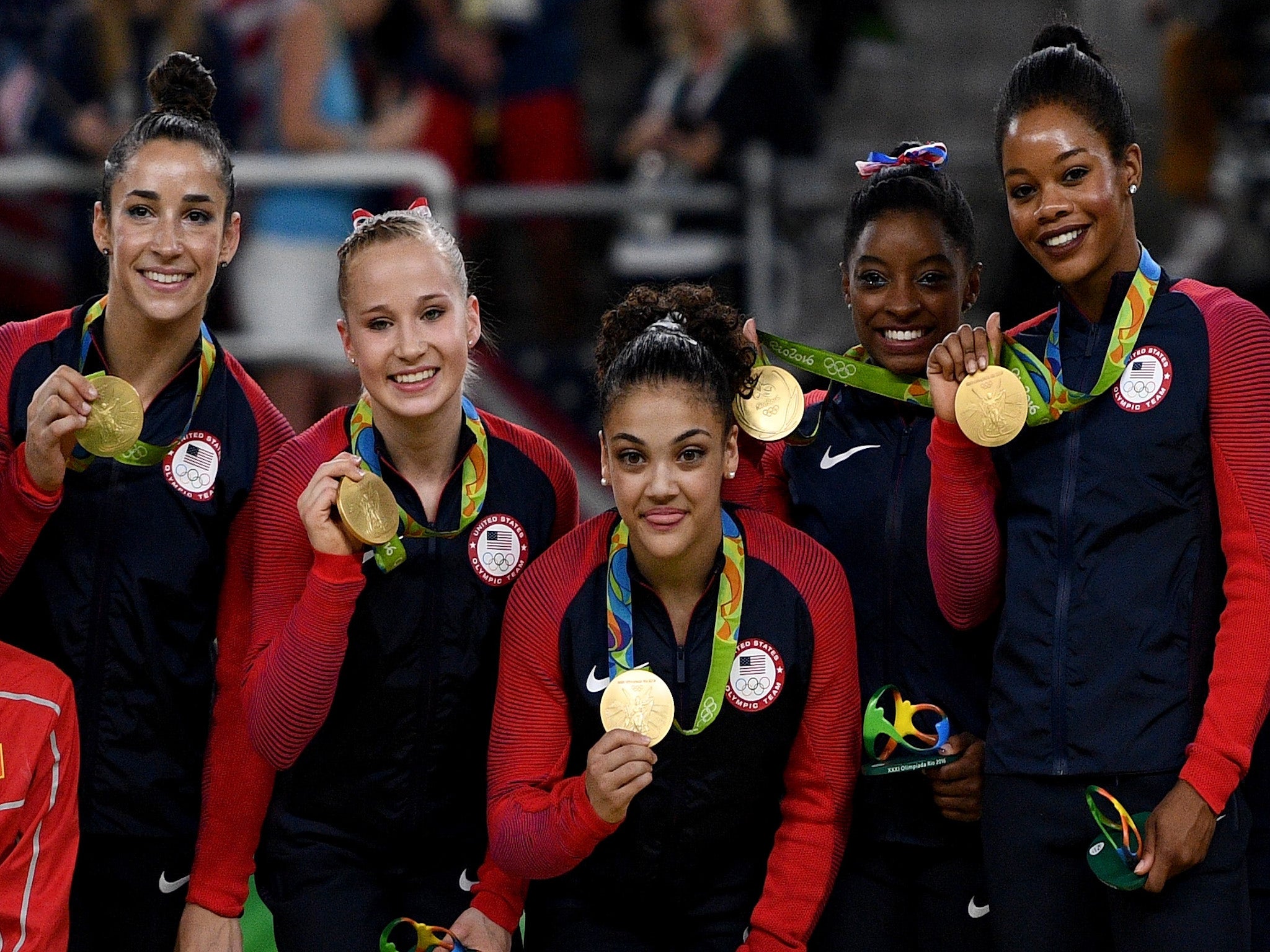 Simone Biles and her United States team-mates show off their gold medals