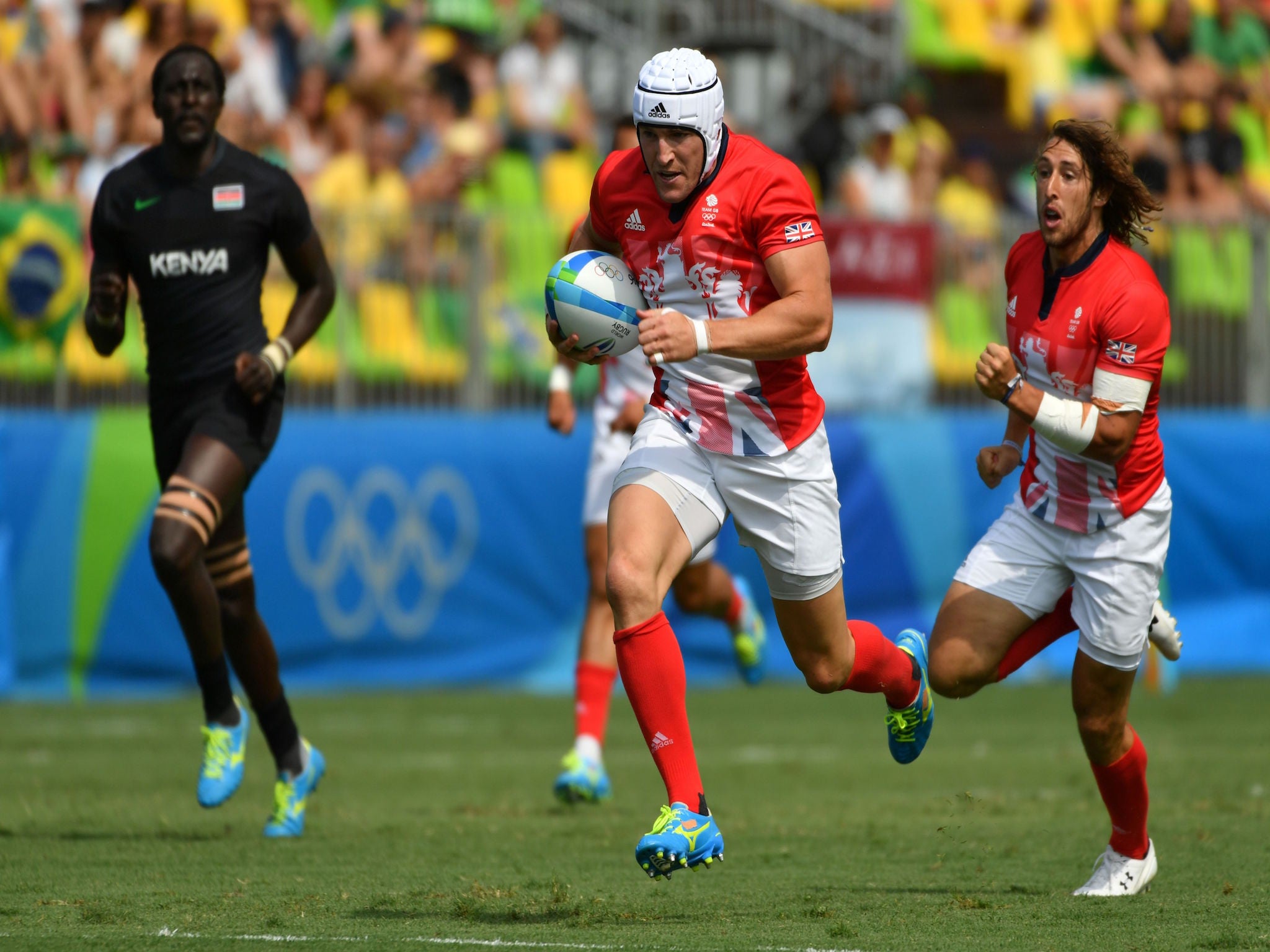 Phil Burgess charges through to score one of Team GB's tries