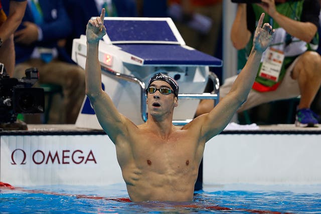 Michael Phelps celebrates his 20th Olympic gold medal