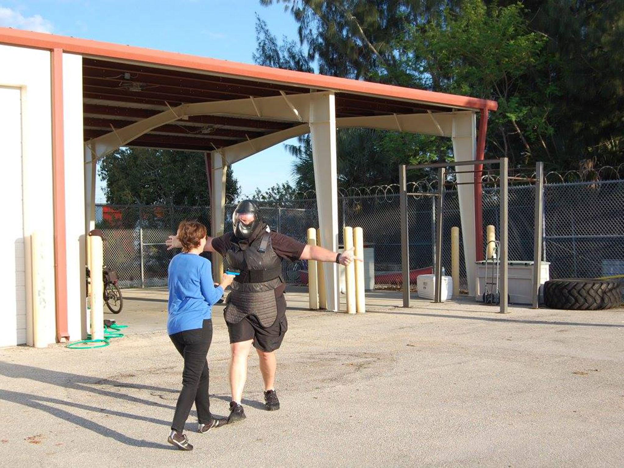 A Citizen's Academy class at the Punta Gorda Police Department, using a mock firearm