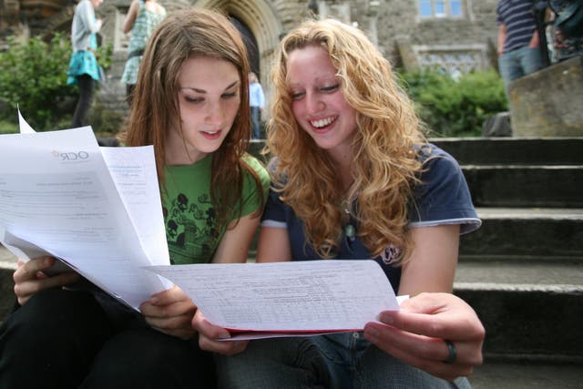 A Level students compare grades on results day. Three per cent more got their first or second choice of university this year than last year