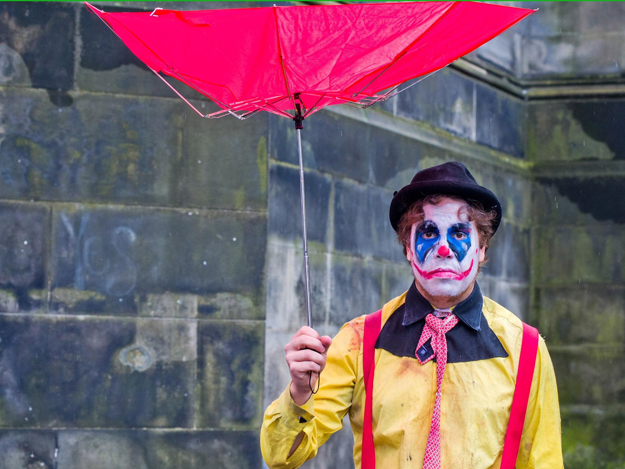 Edinburgh Festival Fringe entertainers perform on the Royal Mile