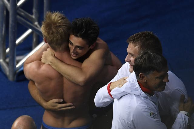 Laugher and Mears embrace after confirmation of their gold