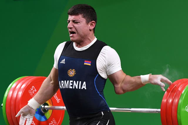 Andranik Karapetyan suffered a dislocated elbow in the men's 77kg weightlifting final