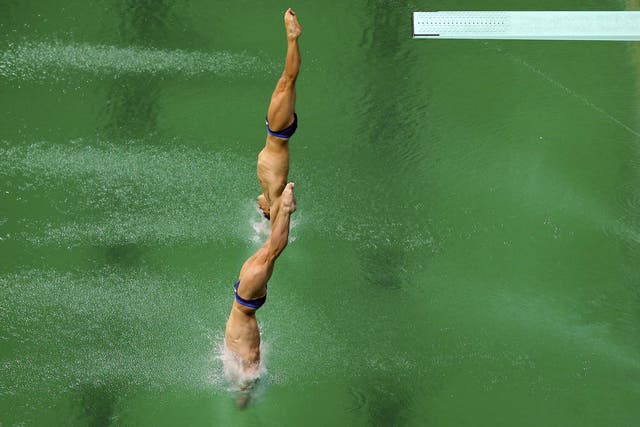 Jack Laugher and Chris Mears of United Kingdom jump into the lush pool