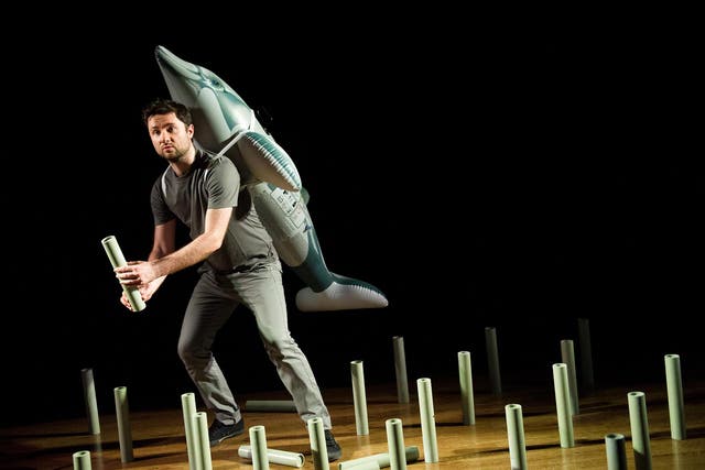 Successful visual metaphor: David Ralfe sports an inflatable dolphin