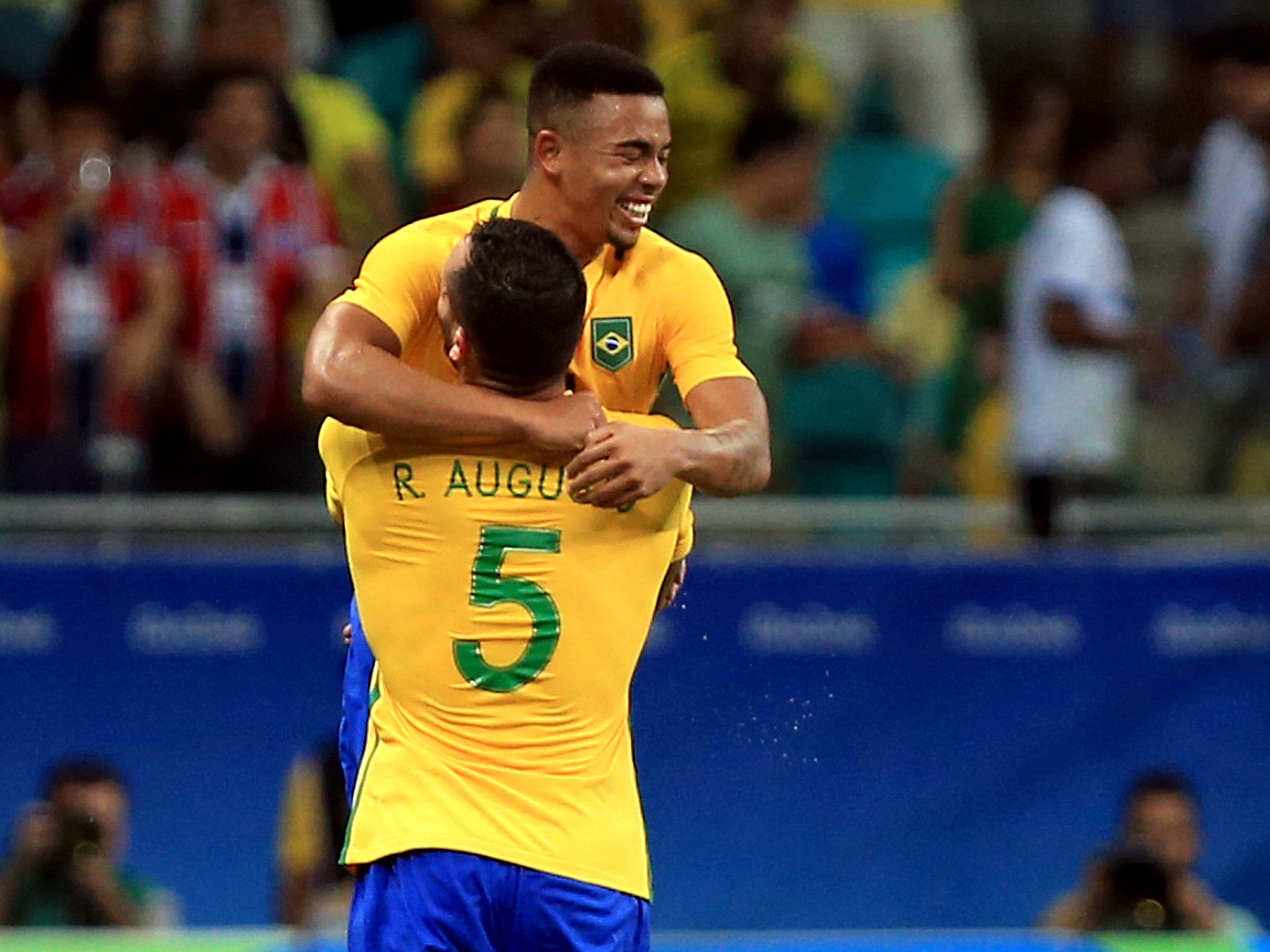 Gabriel Jesus celebrates with Renato Augusto