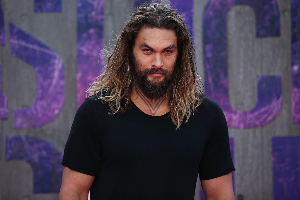 Actor Jason Momoa poses as he arrives to attend the European premiere of the film Suicide Squad in central London on August 3, 2016.