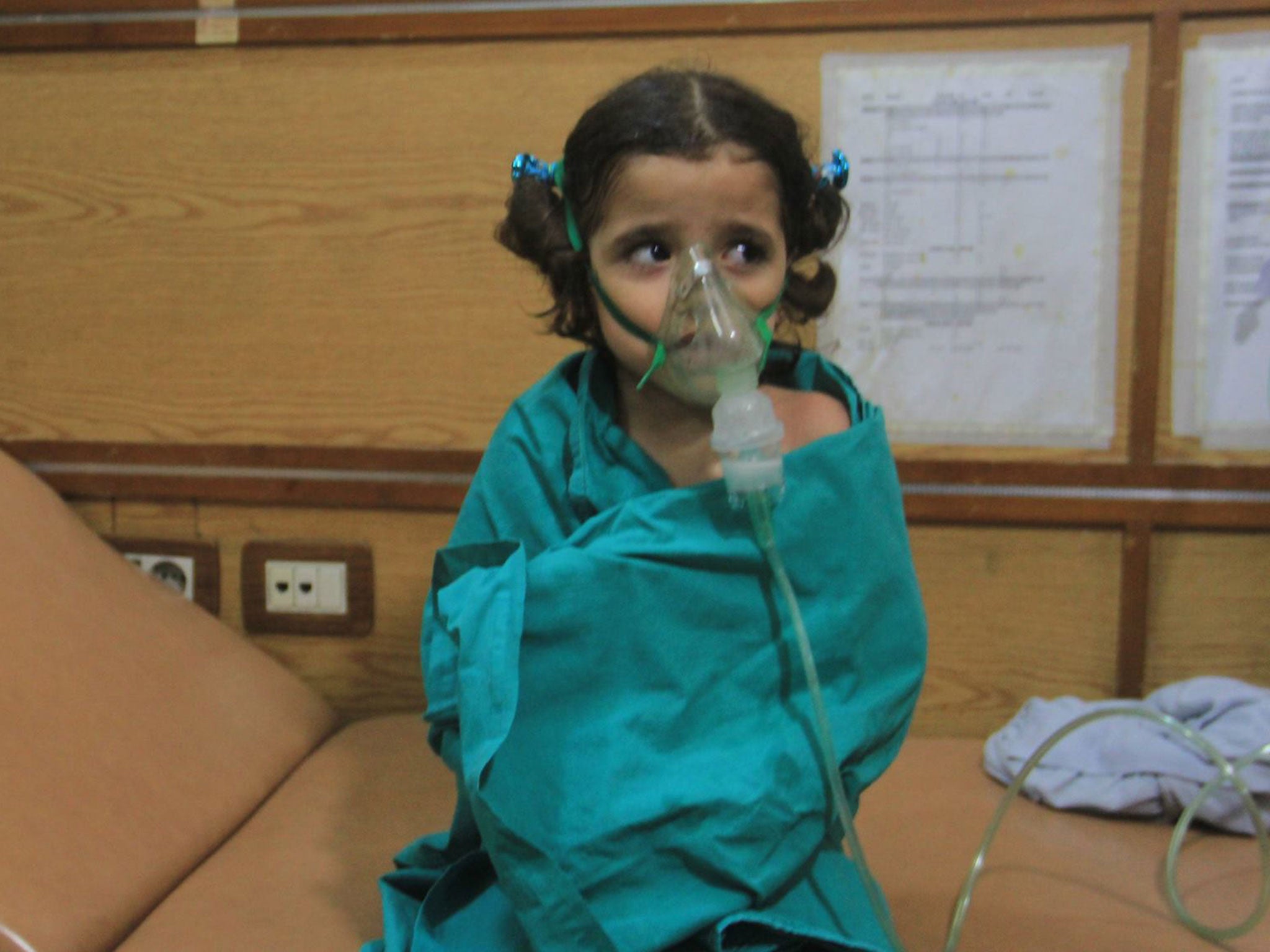 &#13;
Children were given emergency treatment and oxygen masks after a suspected gas attack in Aleppo on Thursday &#13;