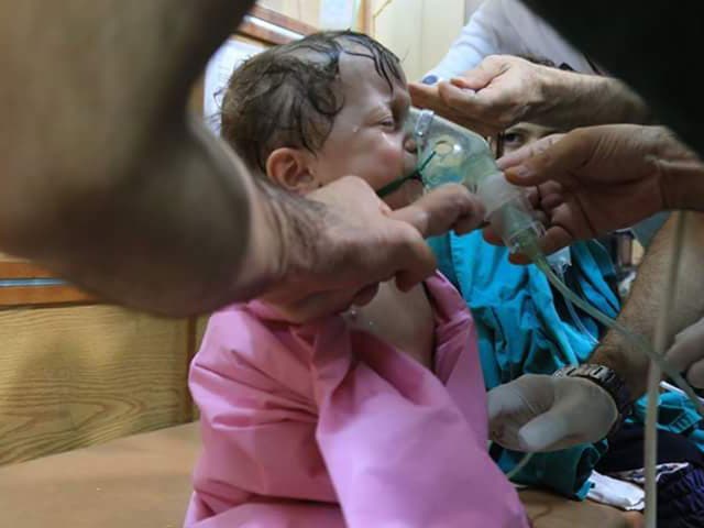 A child being treated in hospital after a suspected chlorine gas attack in Aleppo on 10 August