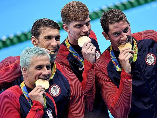Ryan Lochte (bottom left) has seen his hair turn green due to the chlorine in the Olympic swimming pool