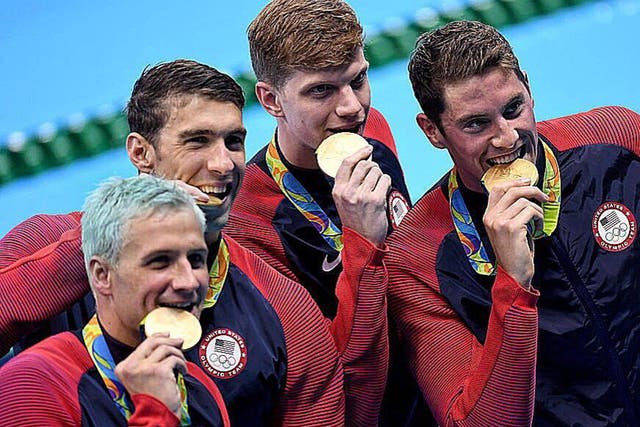 Ryan Lochte (bottom left) has seen his hair turn green due to the chlorine in the Olympic swimming pool