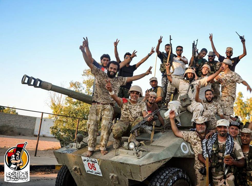 US backed forces celebrate re-taking Sirte, Libya from Isis