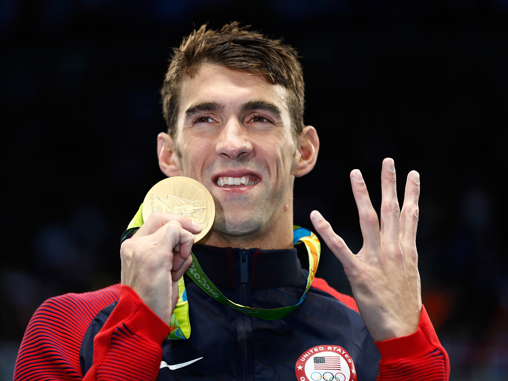 Phelps poses with his 22nd Olympic gold medal