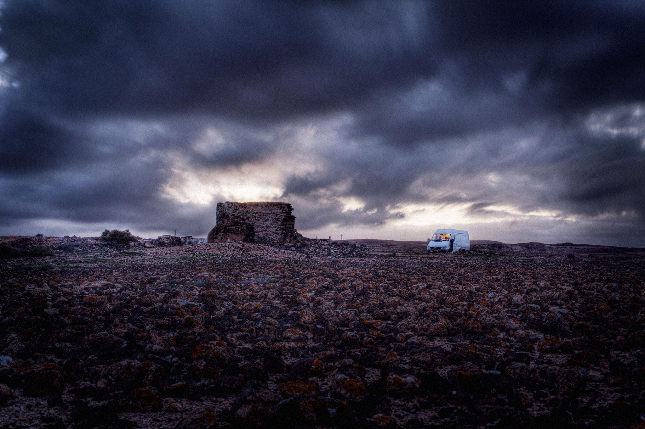 "The small van in the rocky landscape at dusk... it captures the feeling of being lost in the scale of the world," says Arthur