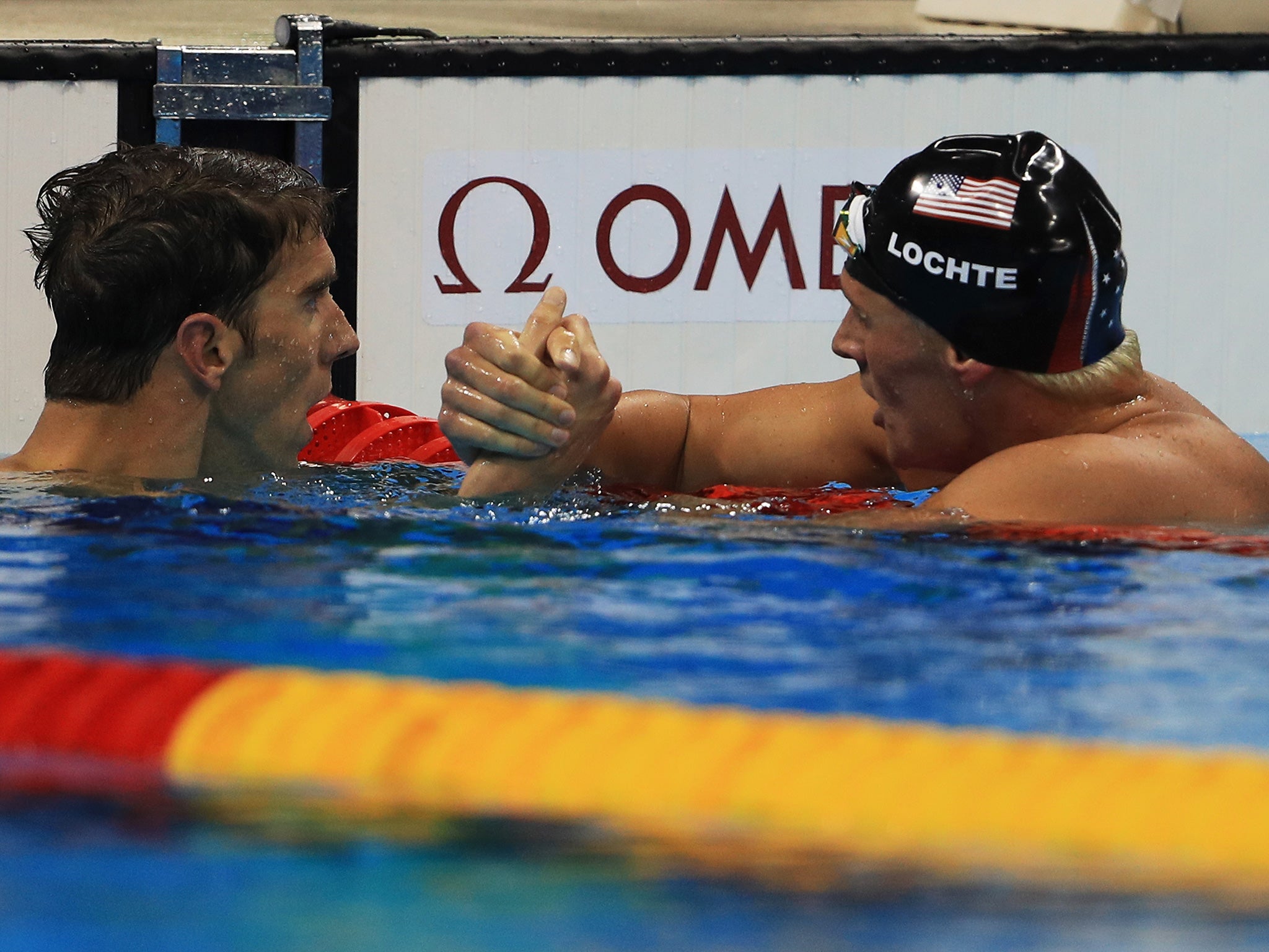 Ryan Lochte is congratulated by fellow US gold-medallist Michael Phelps