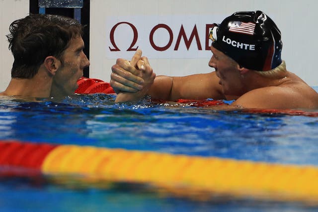 Ryan Lochte is congratulated by fellow US gold-medallist Michael Phelps