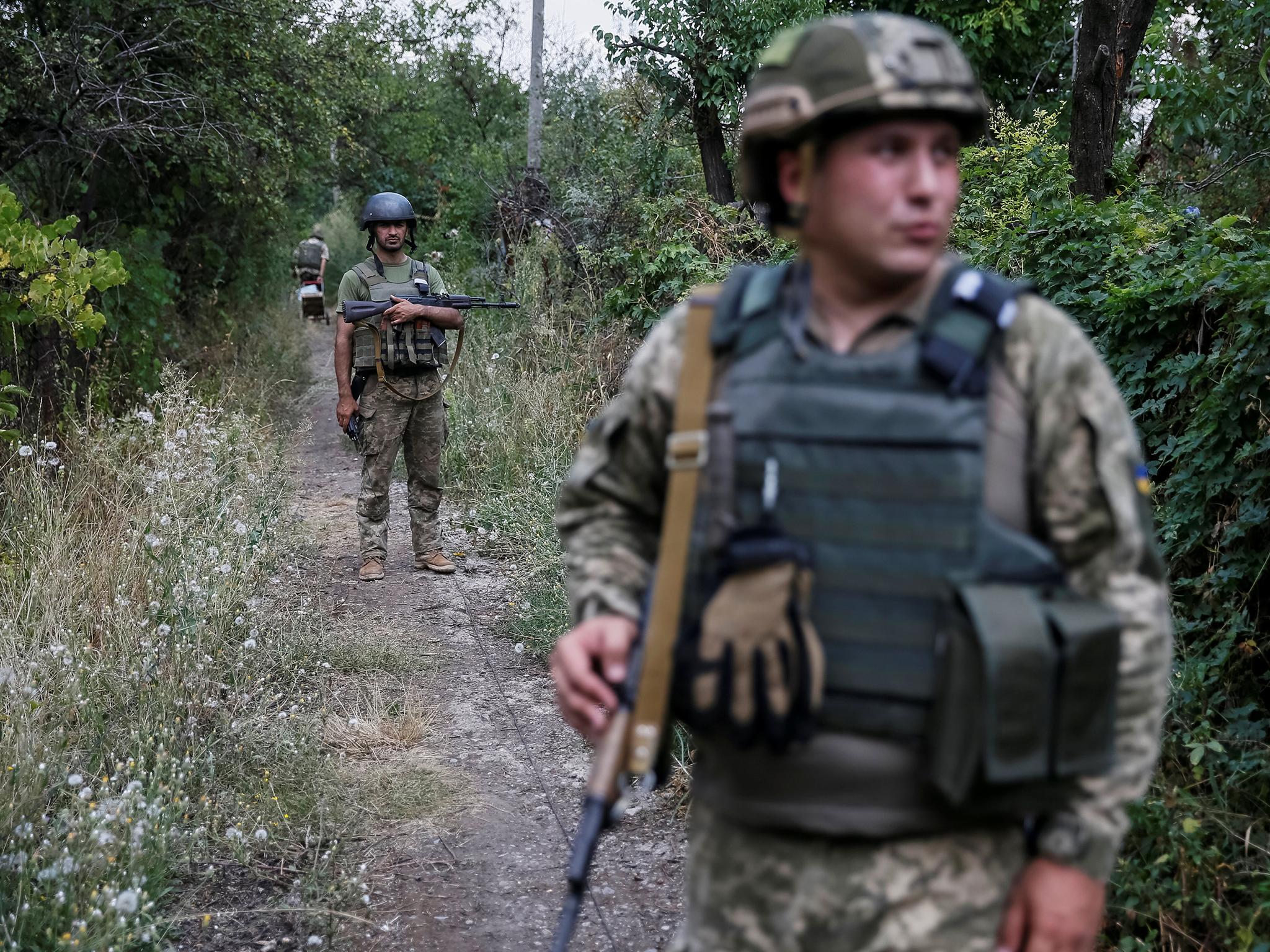 Ukrainian servicemen are seen at their positions on the front line near Avdeyevka, Ukraine