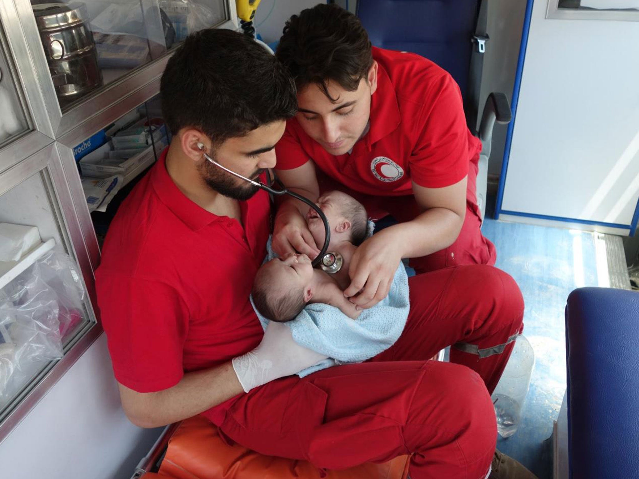 Conjoined twins Moaz and Nawaz being evacuated from Ghouta to Damascus by the Syrian Arab Red Crescent on 12 August