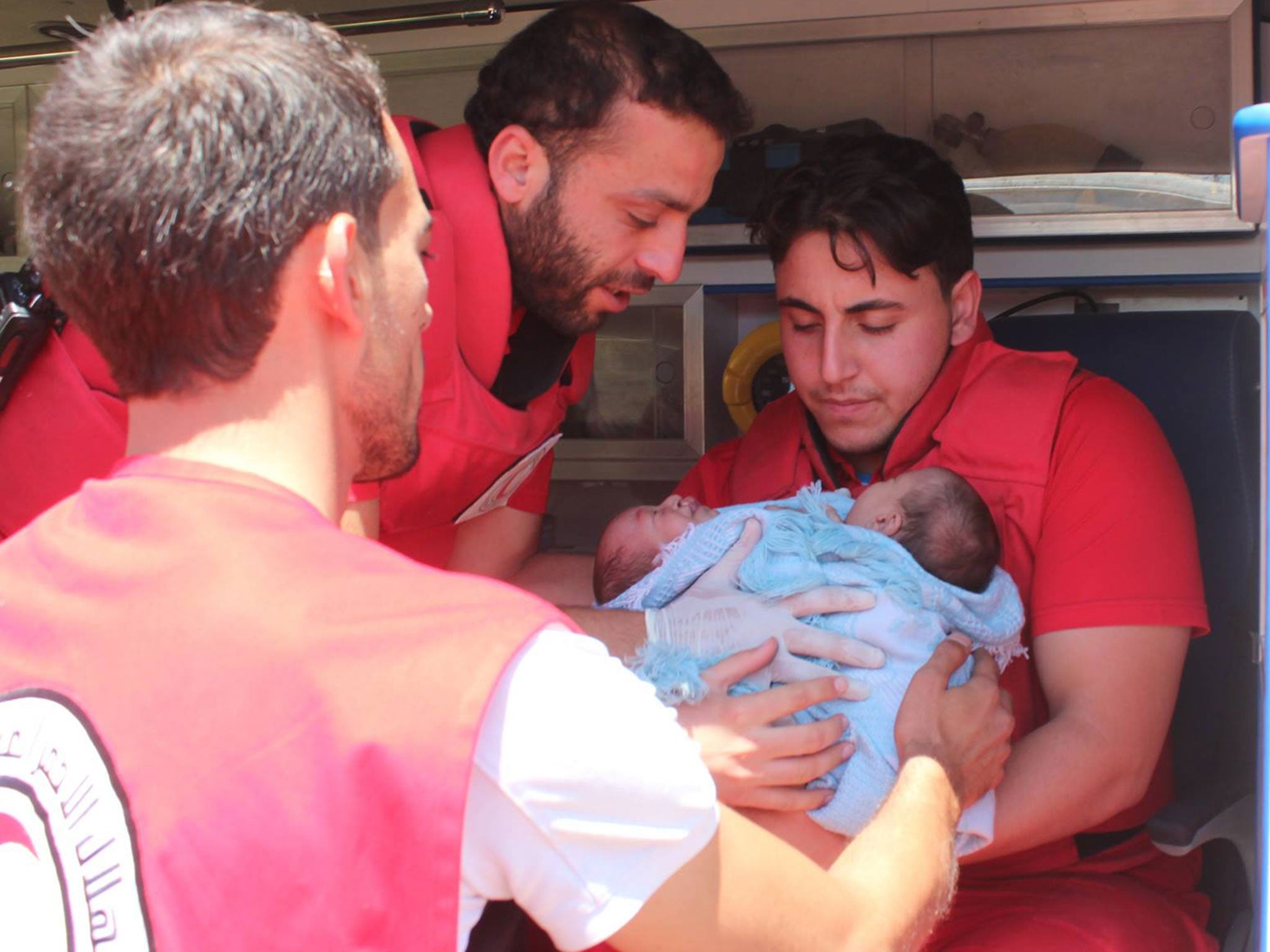 Conjoined twins Moaz and Nawaz being evacuated from Ghouta to Damascus by the Syrian Arab Red Crescent on 12 August